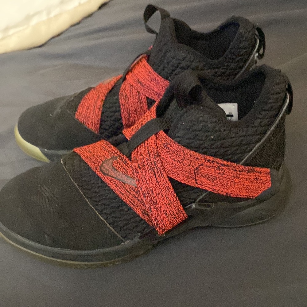 Black and red Velcro Nikes